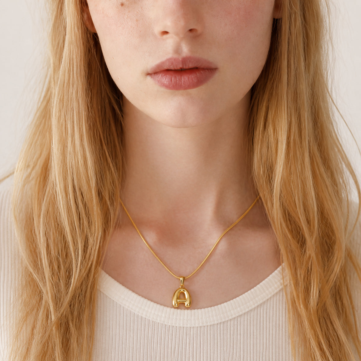 Bubble Initial Necklace worn by model
