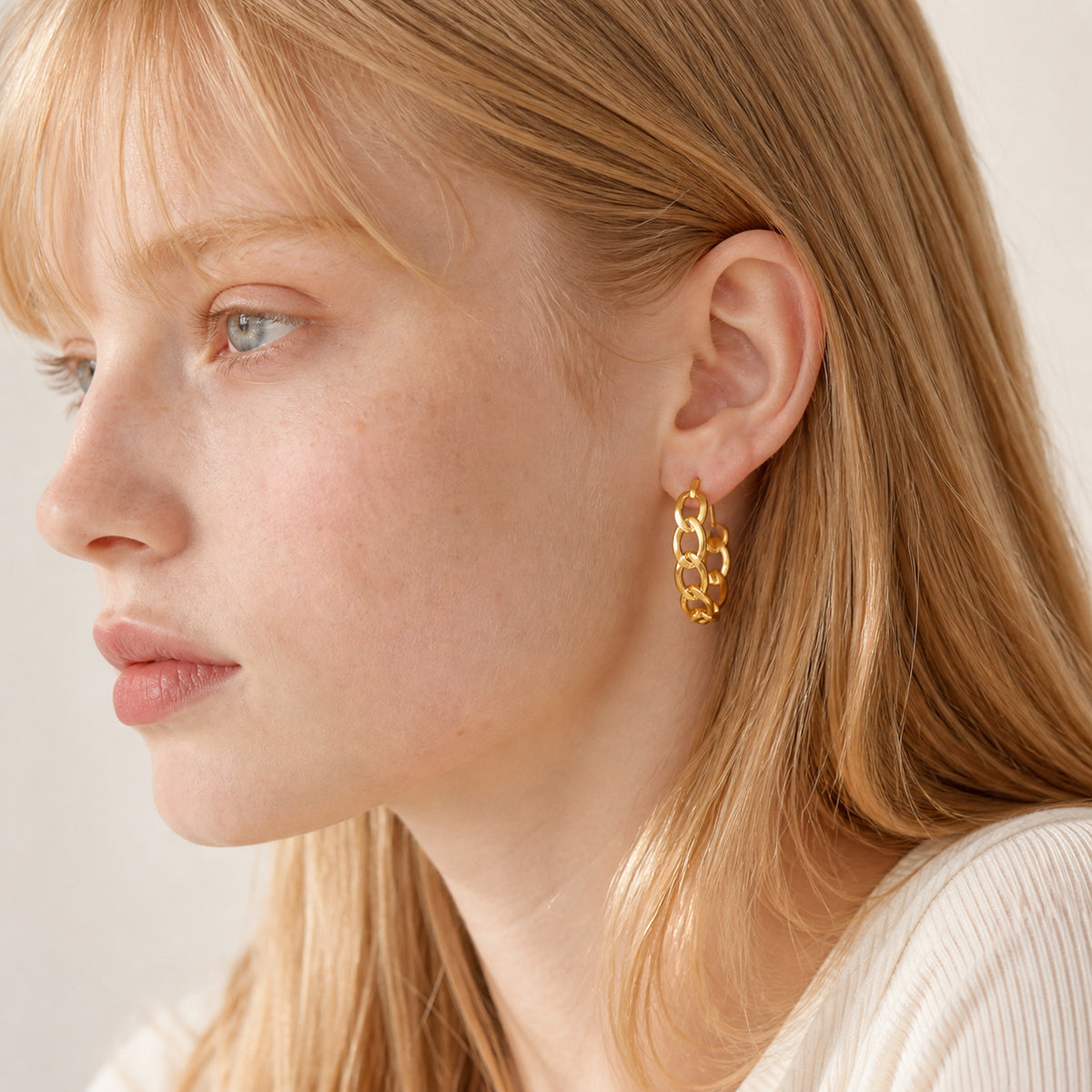 Interlocking Link Stud Earrings worn by model