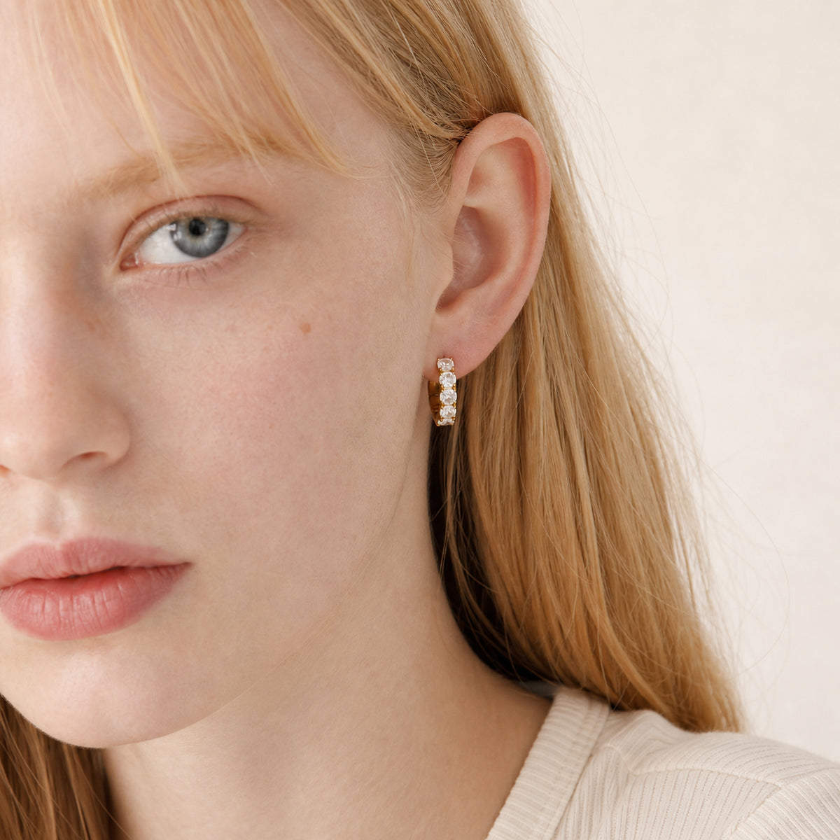 Gold Crystal Stud Earrings worn by model